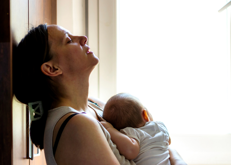 Tired mum with baby sleeping on her chest - Arlie Hastings Lactation Consultant. Breastfeeding support home visits in Gold Coast, Tamborine, Logan and Redlands. Telehealth video chat consultations.