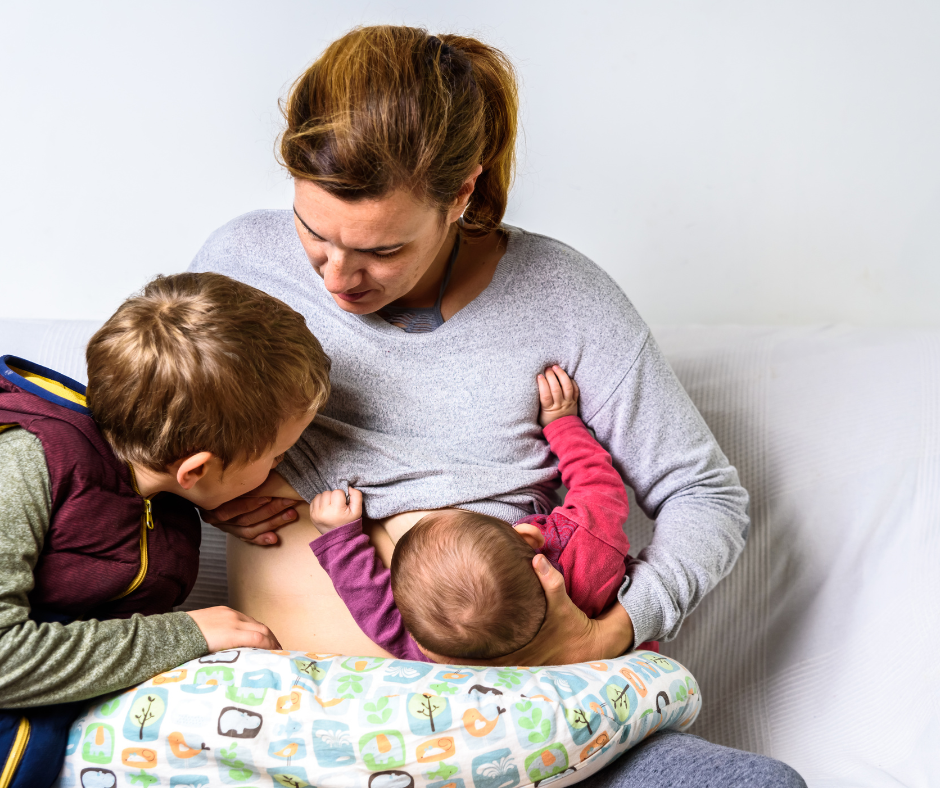 mother breastfeeding her toddler and newborn -tandem breastfeeding - breastfeeding while pregnant - Arlie Hastings Lactation Consultant. Breastfeeding support home visits in Gold Coast, Tamborine, Logan and Redlands. Telehealth video chat consultations.